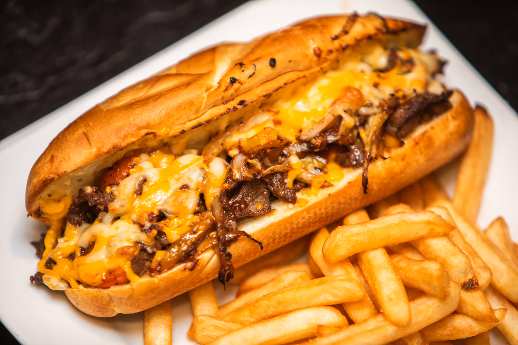 A Pub 36 Philly cheesesteak served with fries