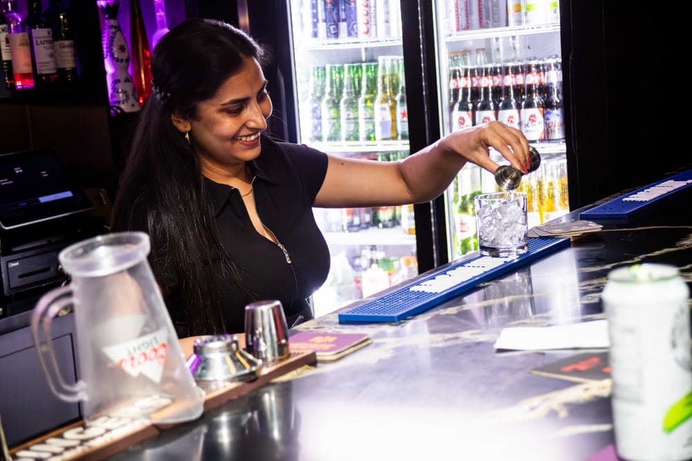 A drink being poured behind the bar at Pub 36